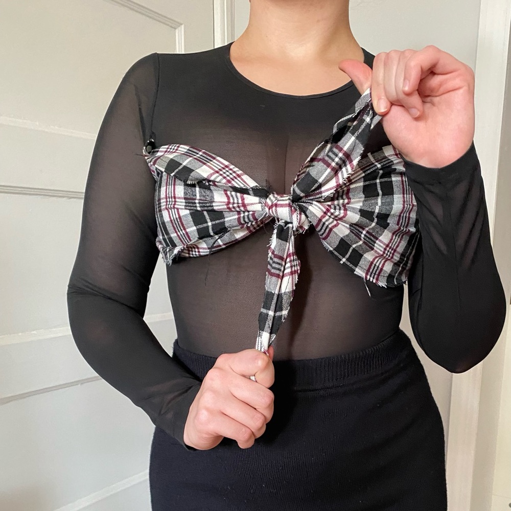 Fashion Nova sheer black bodysuit with plaid fabric tied across the chest